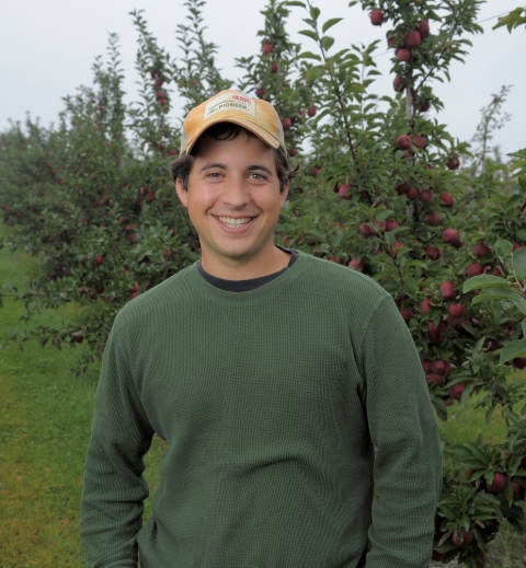 Brett Schuyler in his orchard